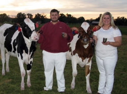 Billy Cameron and Celia Thomas with their champion heifers